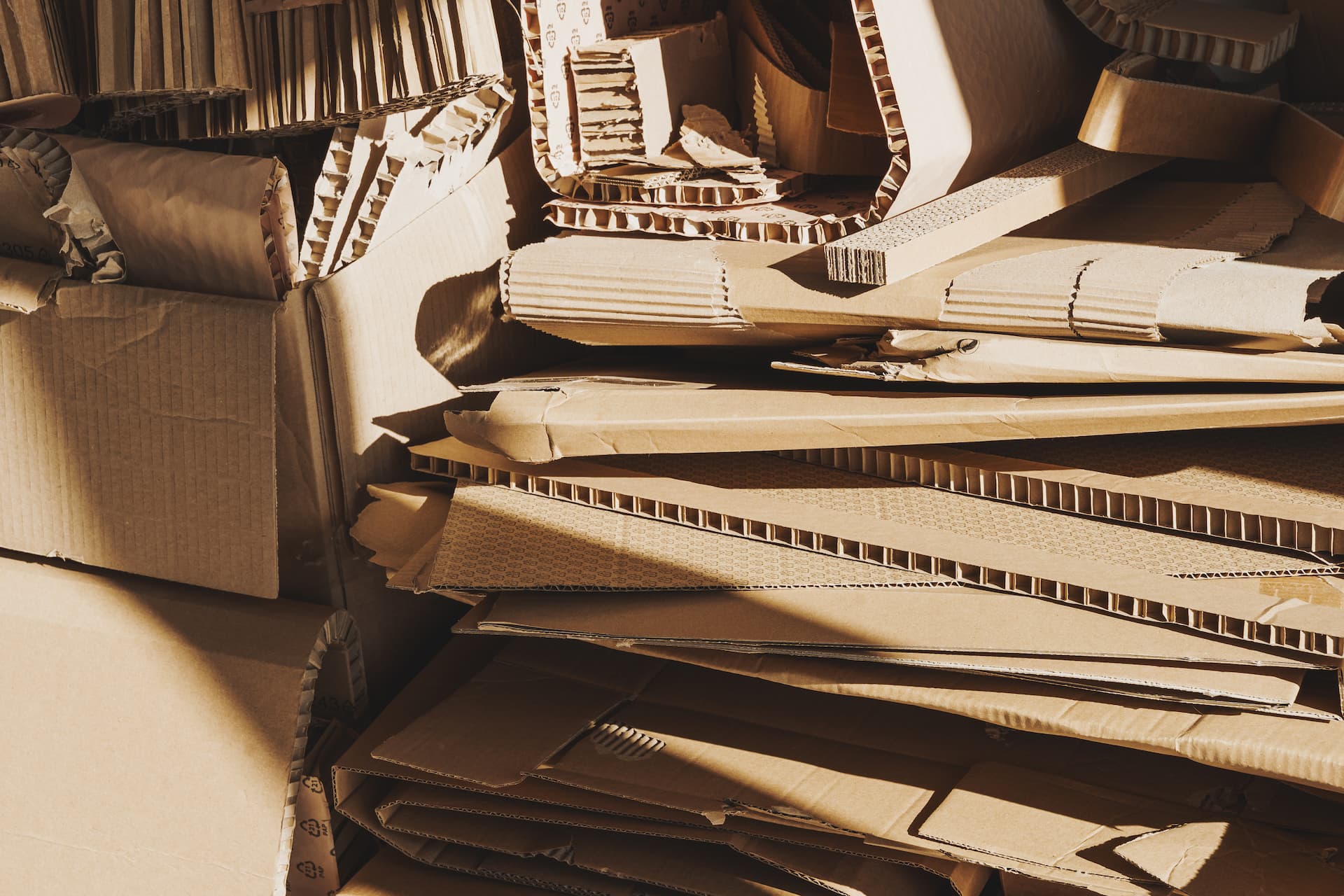 stack-of-cardboard-waste-in-sunlight-concepts-of-2024-10-13-22-15-17-utc (1)